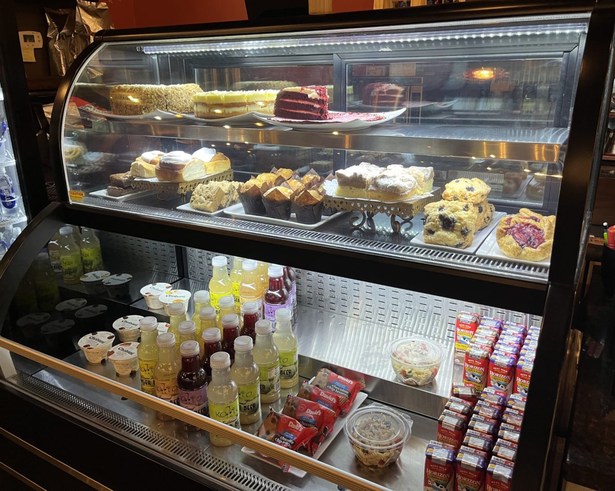 the bakery case at Jirani Coffee House features handmade sweets and grab-and-go beverages