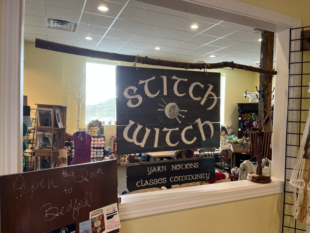 The Stitch Witch interior sign: yarn, notions, classes, community