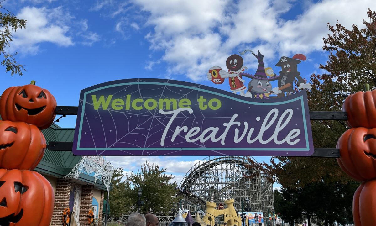 a sign reads "Welcome to Treatville" and leads visitors to the trick-or-treat trail at Hersheypark Halloween