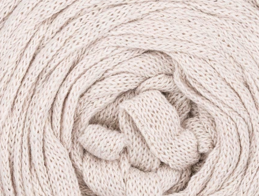 a close-up of Hoooked Ribbon XL yarn shows the detail of the fibers in Sandy Ecru