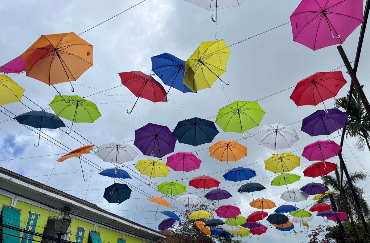 colorful umbrellas suspended above the roadway